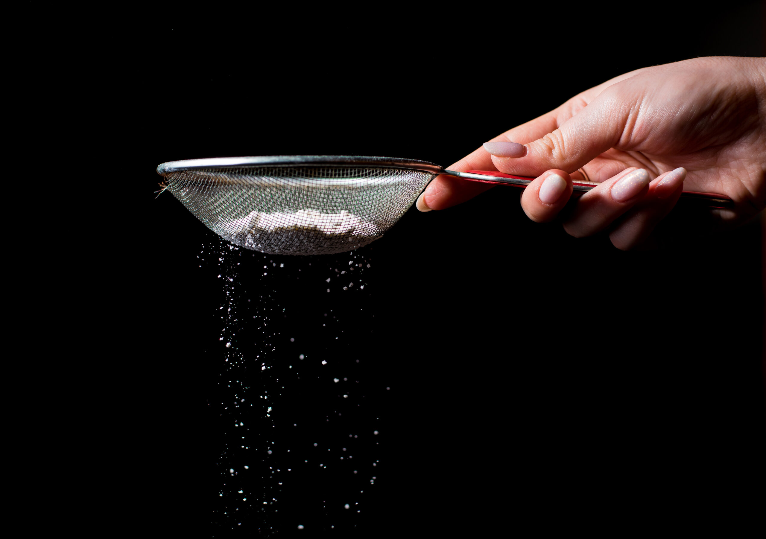 Sieve,With,Flour,On,A,Dark,Background